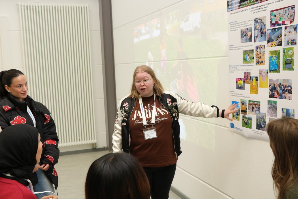 Young woman explaining poster